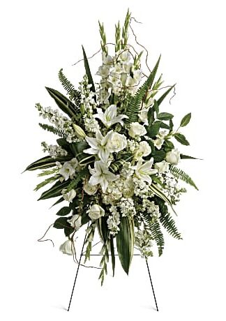 Elegant all-white standing spray featuring fresh flowers, designed for funerals and memorial services."