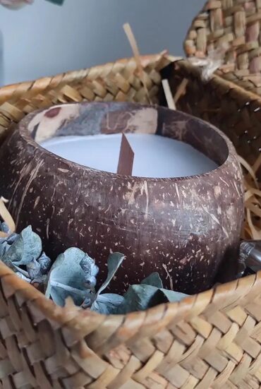 Handmade soy wax candle in coconut shell bowl with natural oils" "Eco-friendly coconut shell candle with soy wax and essential oils" "Coconut shell bowl candle with natural essential oils, handmade" "Unique desert-inspired soy wax candle in coconut shell bowl"