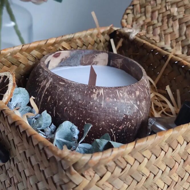 Handmade soy wax candle in coconut shell bowl with natural oils" "Eco-friendly coconut shell candle with soy wax and essential oils" "Coconut shell bowl candle with natural essential oils, handmade" "Unique desert-inspired soy wax candle in coconut shell bowl"