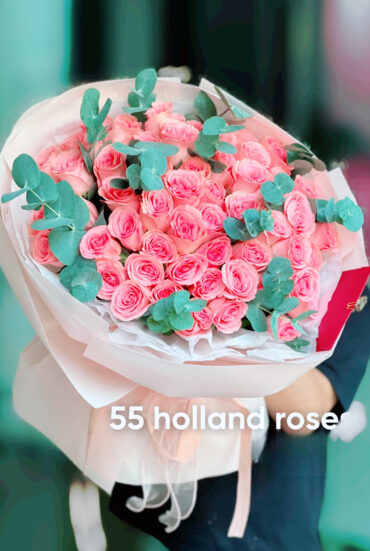 Shop for a stunning bouquet of 55 light pink roses paired with fresh eucalyptus. Perfect for anniversaries, weddings, and special occasions. A fragrant and romantic flower arrangement, hand-arranged with love."