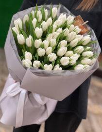 A stunning arrangement of 51 pristine white tulips, radiating elegance and natural beauty.